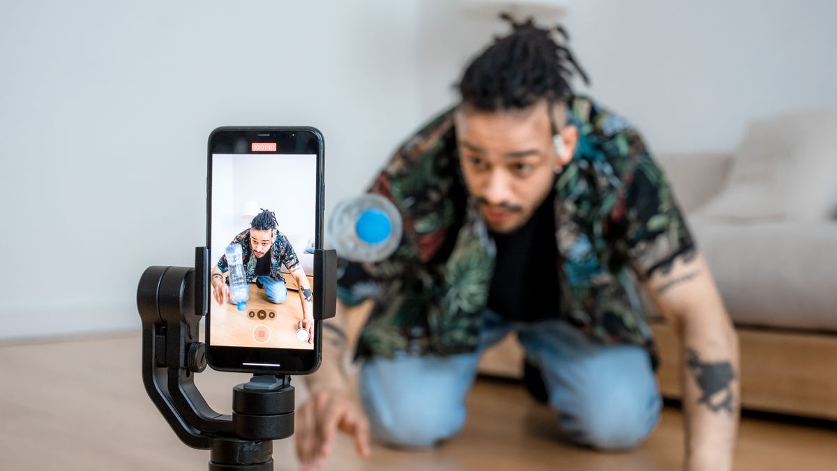 Creator filming content with a smartphone and gimbal