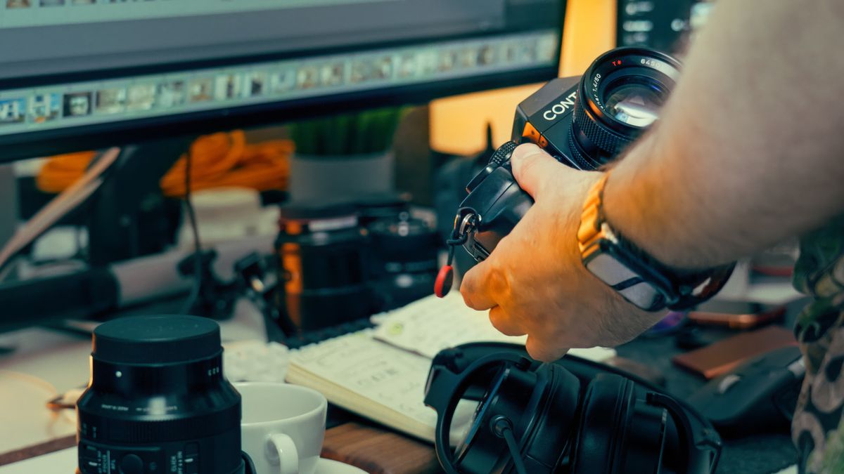 Creative workspace with camera gear and monitors