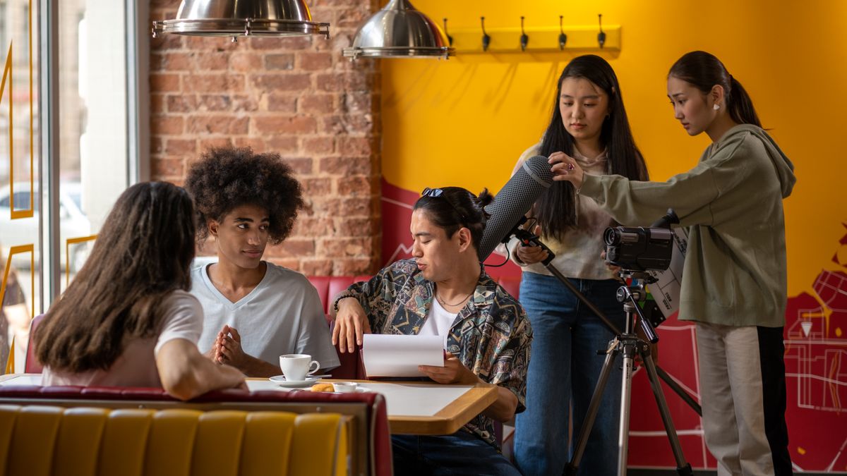 Film crew collaborating on set, the storyboard-first workflow behind AI video ads