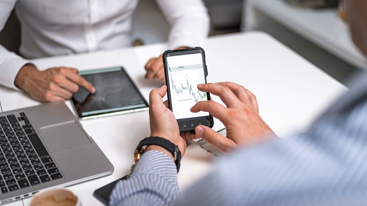 Marketing team analyzing performance data to measure AI video ad costs